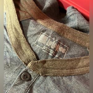 Medium size LuLaRoe man’s T-shirt with button-down halfway